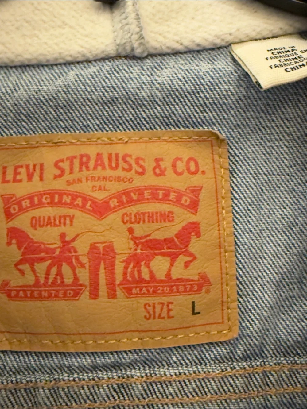 Levi's Blue Denim Jacket with Light Gray Hoodie Sleeves